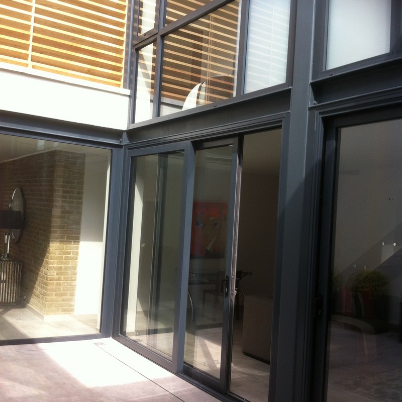Anthracite aluminium sliding patio doors fitted in Westcombe Park