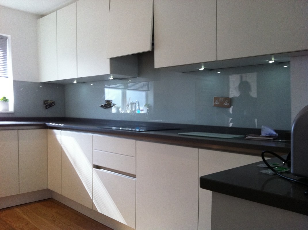 Grey glass kitchen splashback with LED lighting in Westcombe Park