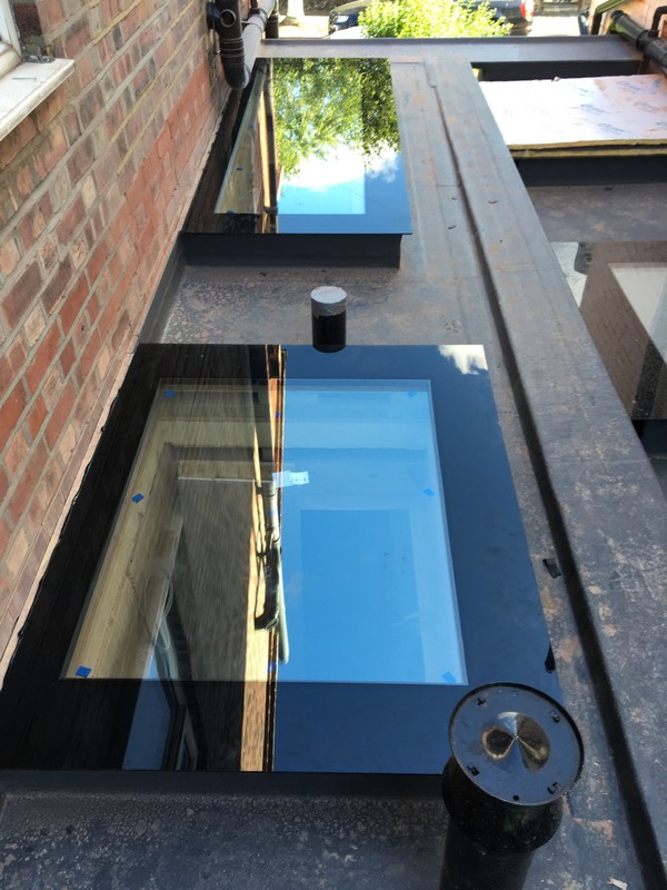 Multiple flat roof skylights on extension in Westcombe Park