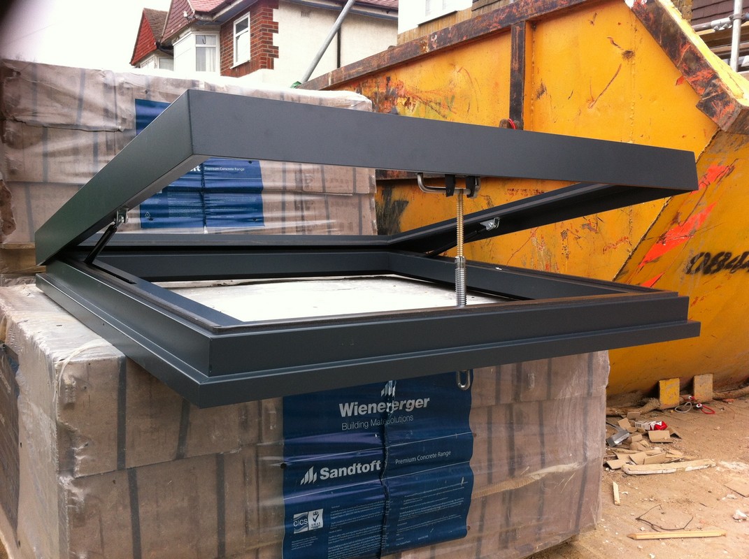 Opening flat roof skylight in anthracite grey installed in Westcombe Park